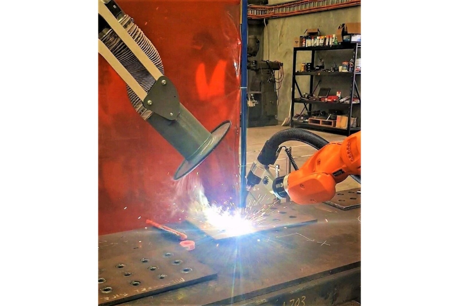 Close-up-of-welding-in-action-and-RAVEX-Mobile-Welding-Fume-Station-arm-extracting-fumes-to-the-left