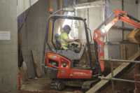 Ravex Diesel Filter Kit M30 on a mini excavator being used internally with two workmen in hi-vis vests