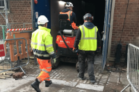 Ravex Diesel Filter Kit M30 on the back of a mini loader being operated by one man in a hi-vis vest