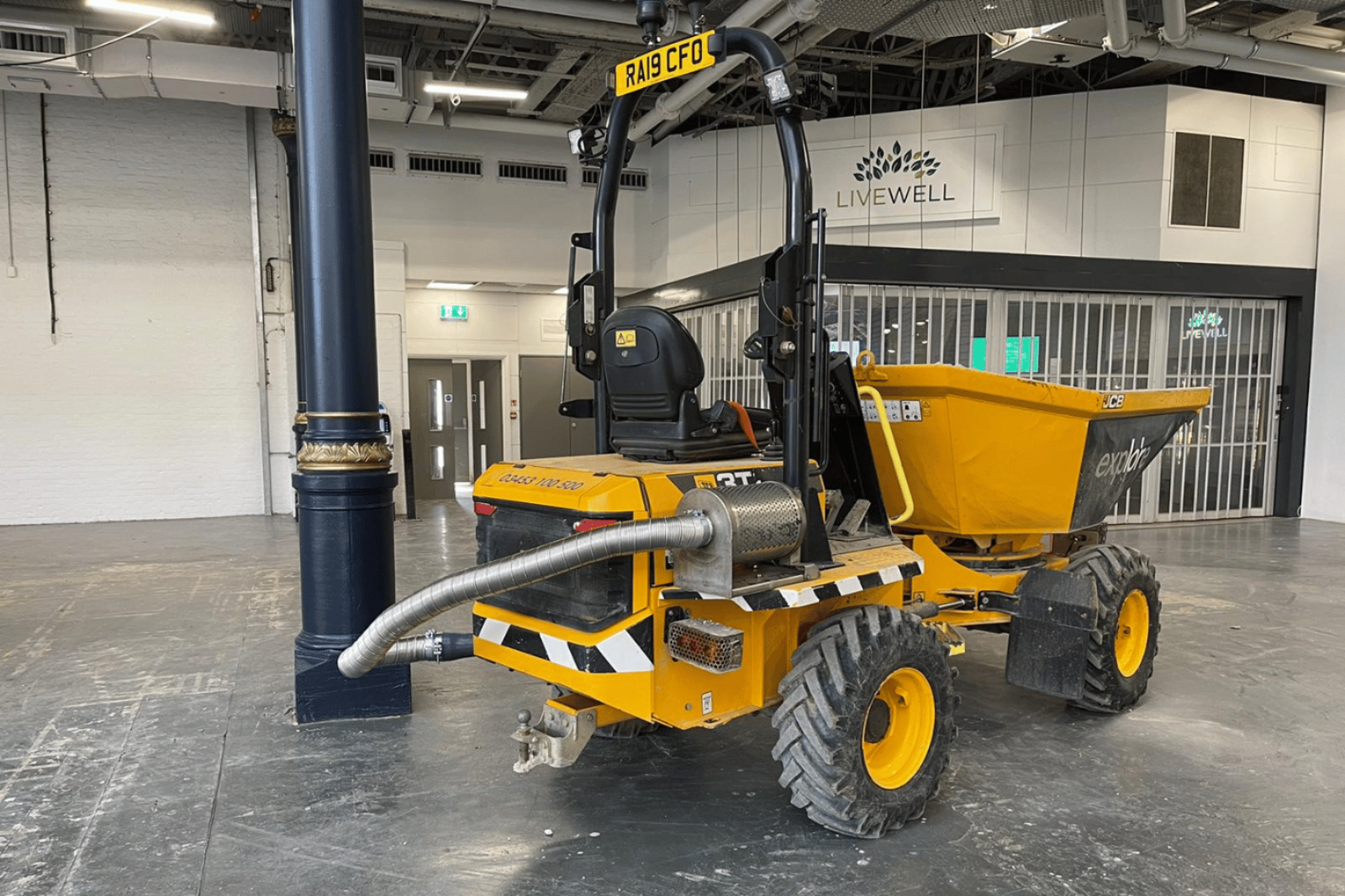 Ravex Diesel Filter Kit M60 on a swivel dumper in front of a small shop