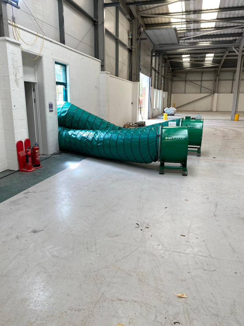 Carousel 3 - Powerful axial fan extraction and ventilation taking place inside a warehouse