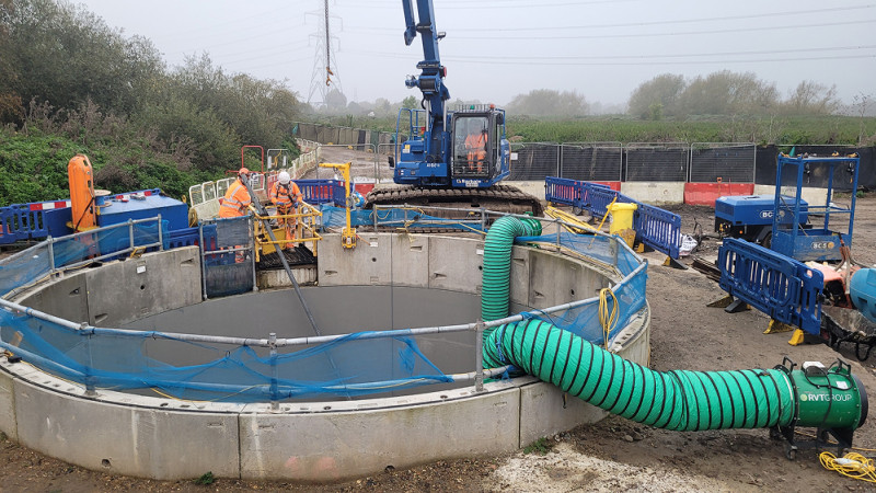 Main image - Small and portable axial fans providing workers inside a shaft with fresh air ventilation at a Water Treatment Works - 1