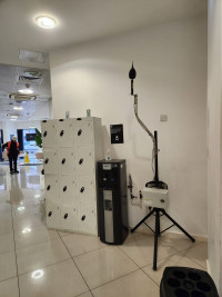Monitex Area noise monitor next to a set of lockers in a University reception area