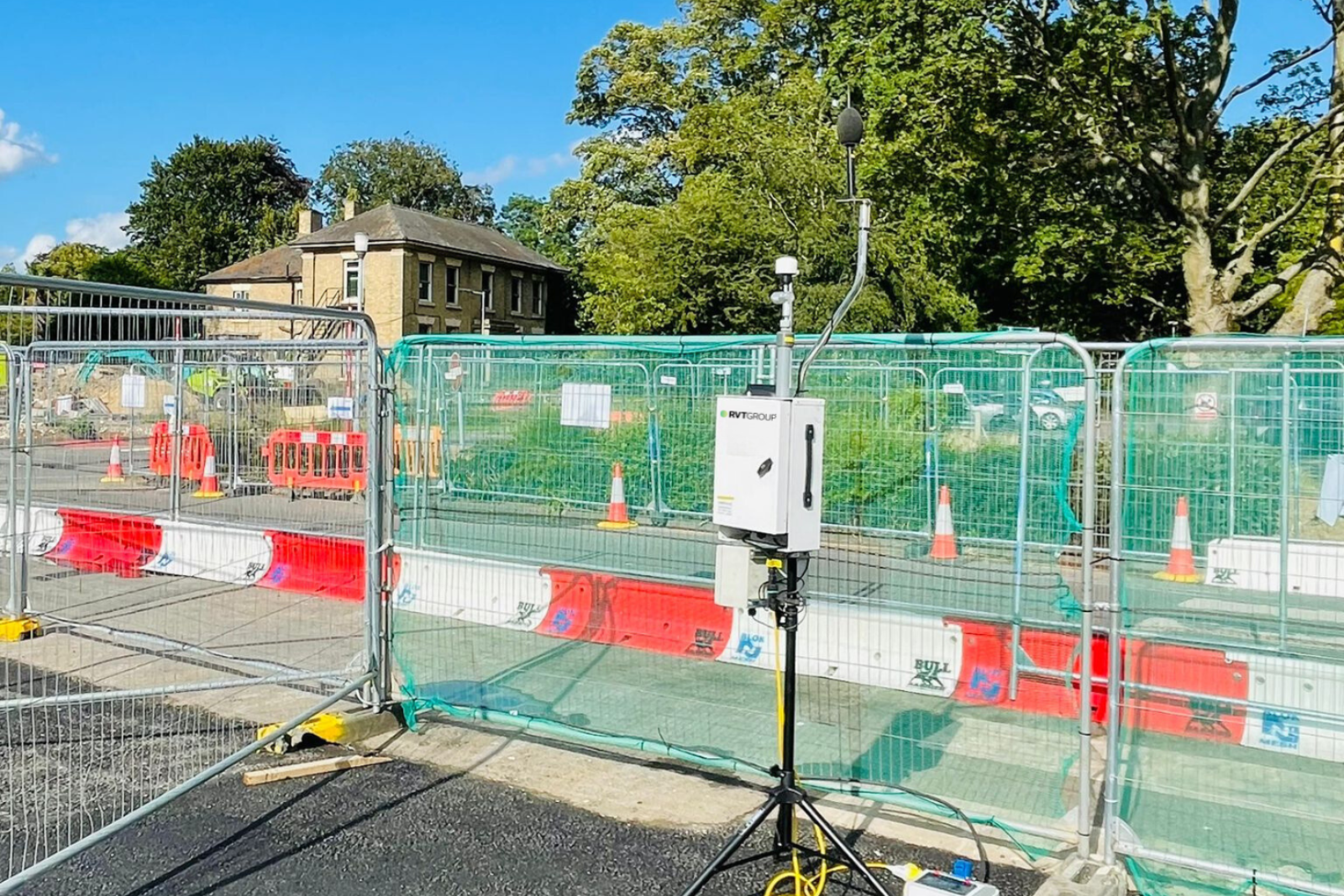 Monitex area dust monitor at the perimeter of excavation works happening in the background