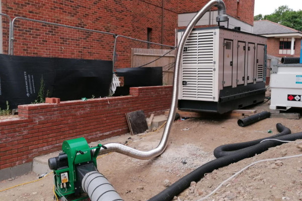 VENTEX Centrifugal Fan 300M making up part of an exhaust fume extraction system with metal piping going from the top of a nearby generator to the fan