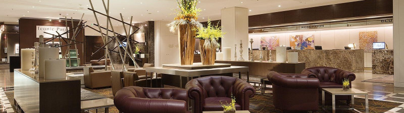 Hotel lobby with seating and a reception desk