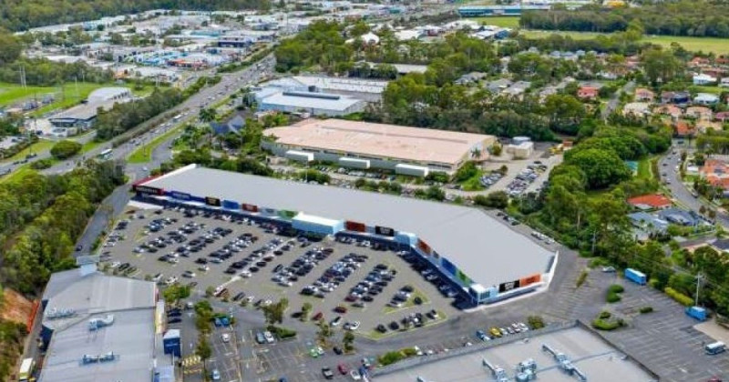 Aerial view of a shopping centre and car park