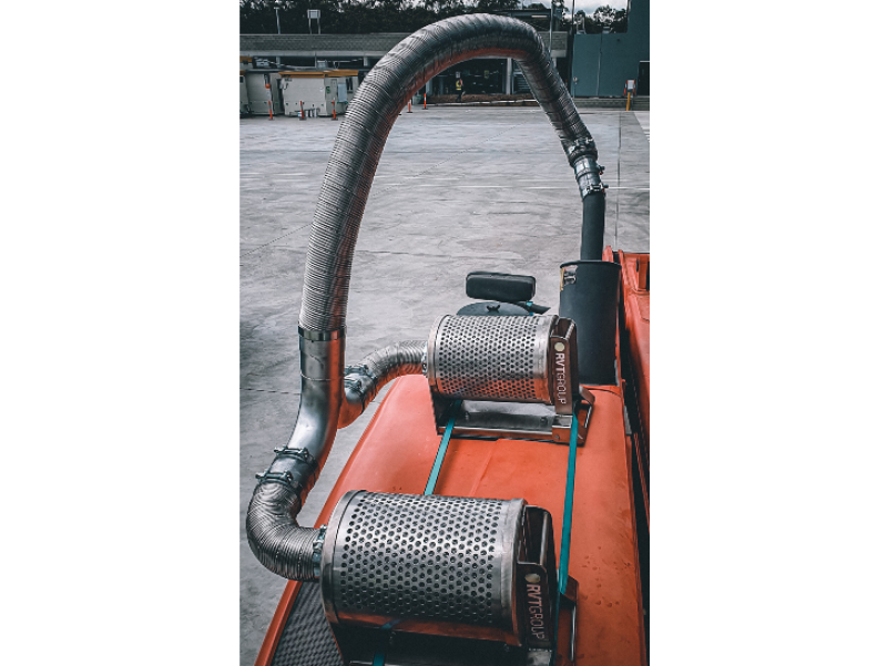 Diesel particulate filters mounted on a machine exhaust stack
