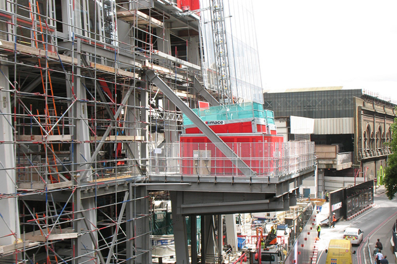 Hoist and scaffolding on the facade of a building under construction