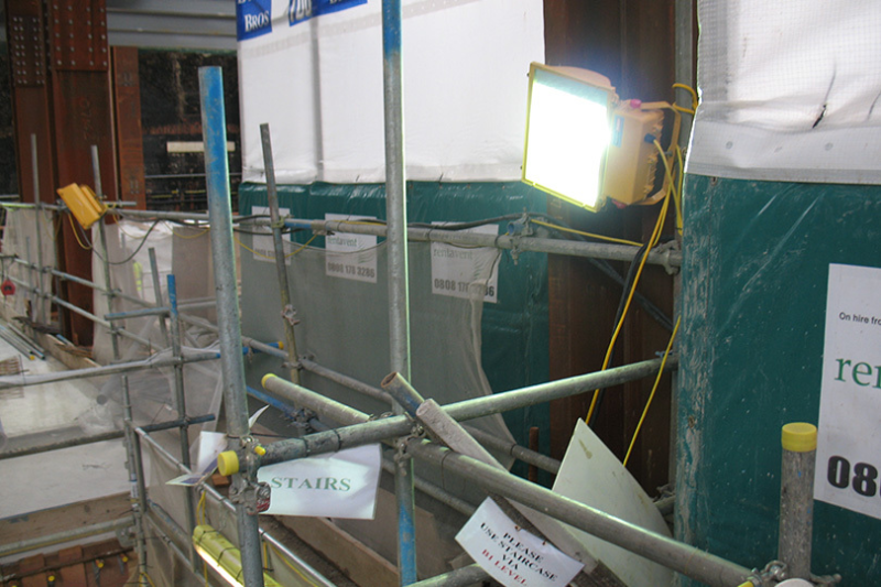 Scaffolding and task lighting on a building refurbishment site