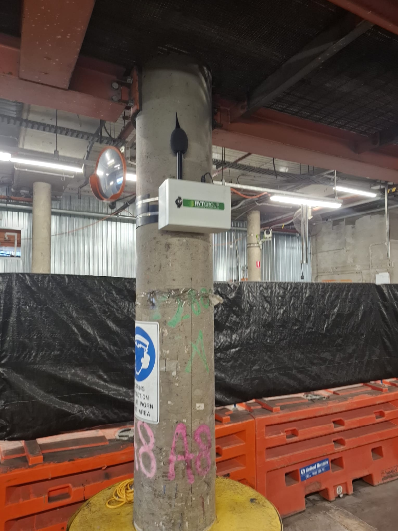 RVT environmental monitor mounted on a column in a basement work area