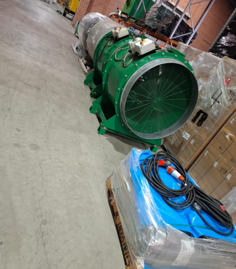 Large green RVT axial fan in a warehouse ready for despatch