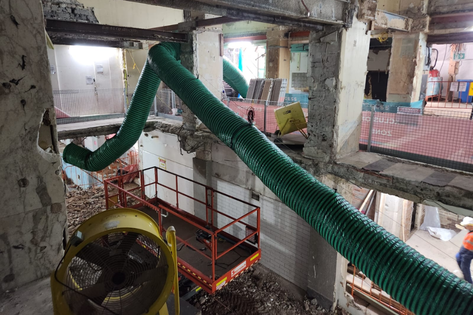 Green ventilation ducting installed through an interior strip out
