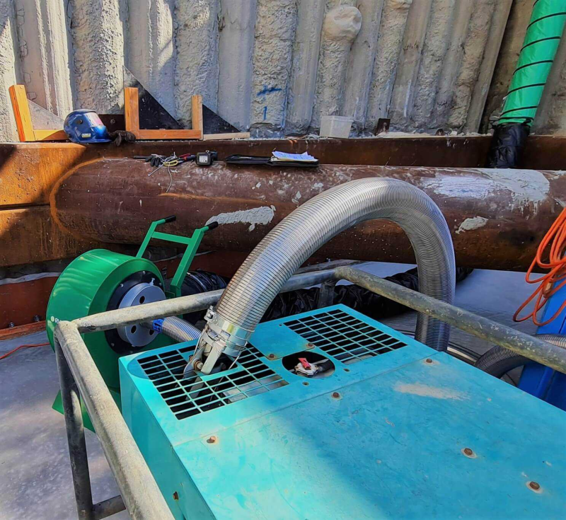 Exhaust filtration connected to plant beside a shoring wall in an excavation