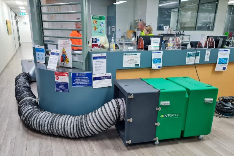 RVT filtration unit and ducting behind a medical centre reception desk