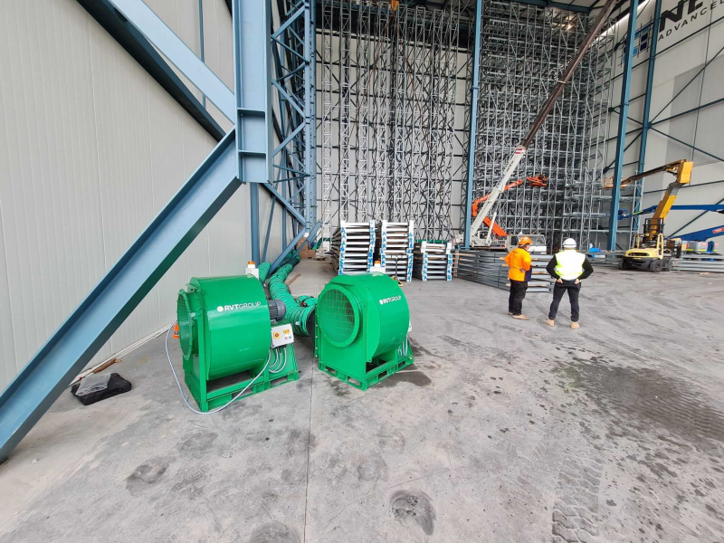Two RVT centrifugal fans supplying ventilation inside a warehouse with automated racking
