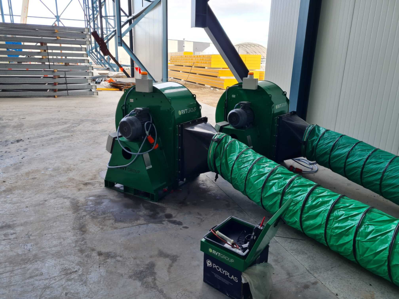 Two RVT extraction units with ducting outside an industrial building