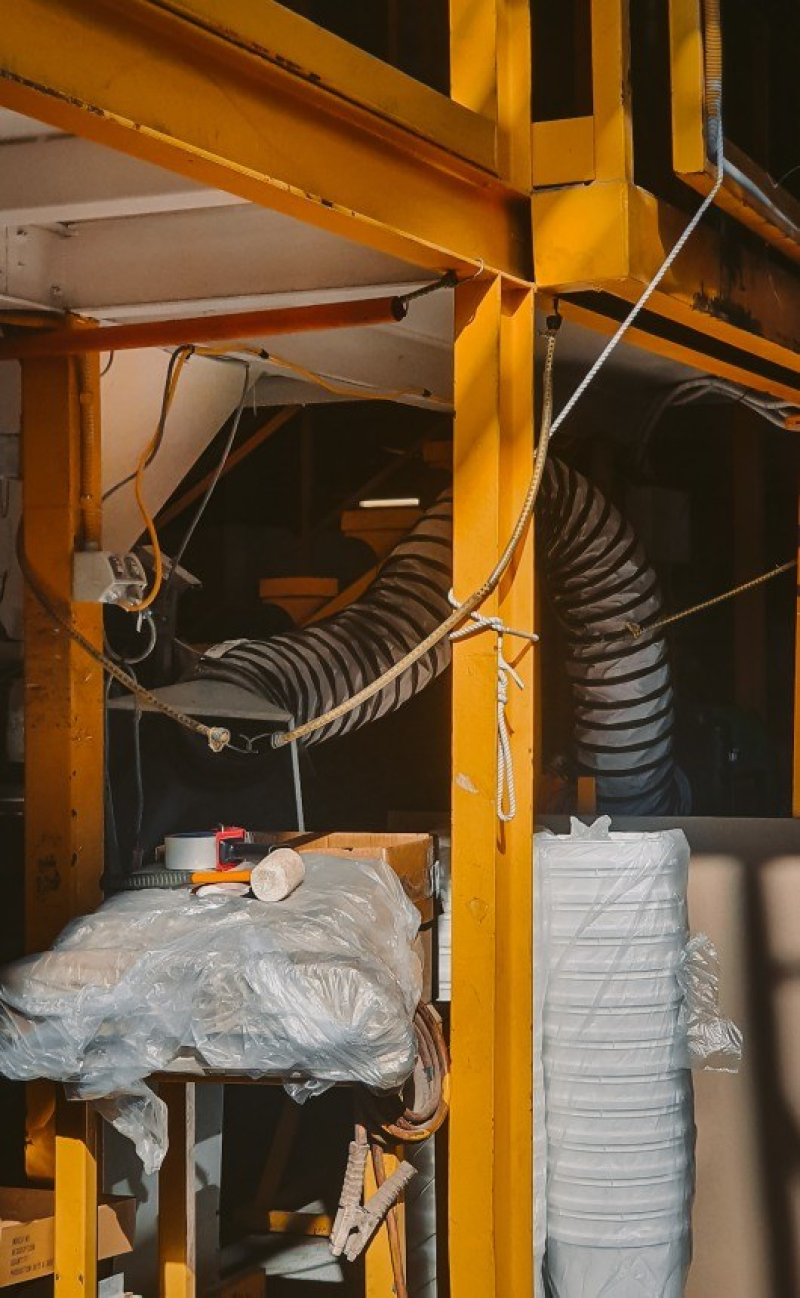Extraction ducting installed above a production line in a manufacturing plant