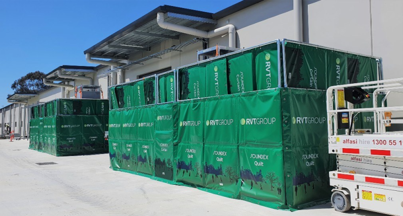RVT SOUNDEX acoustic quilts screening plant beside a new commercial building