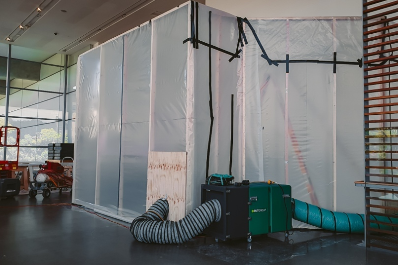 Sealed containment enclosure with filtration unit and ducting inside a gallery