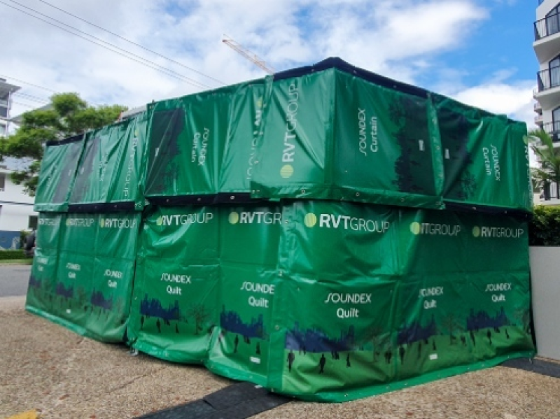 RVT SOUNDEX acoustic curtains and quilts enclosing plant beside apartments